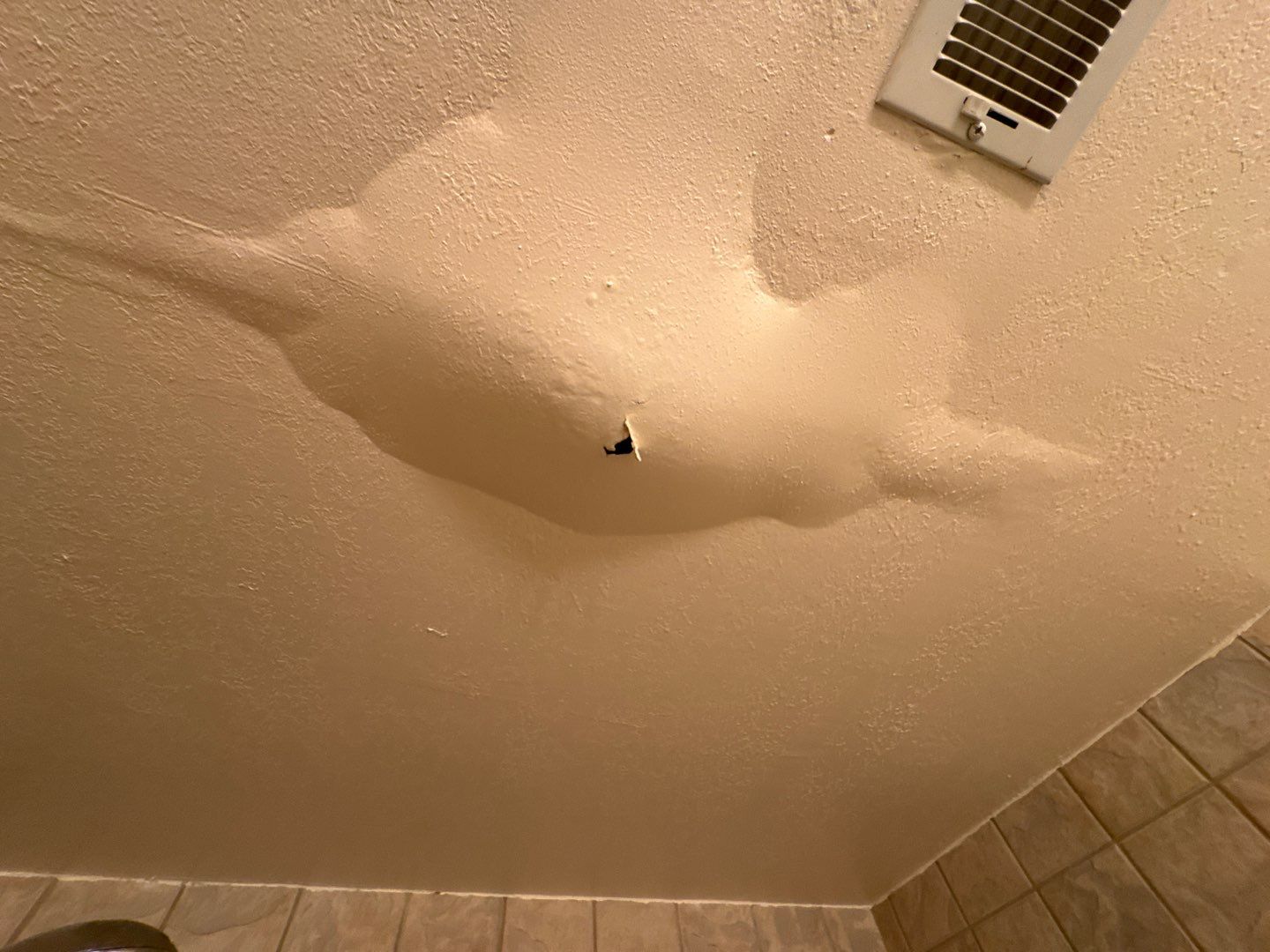 Water damage restoration professionals working on a flooded property